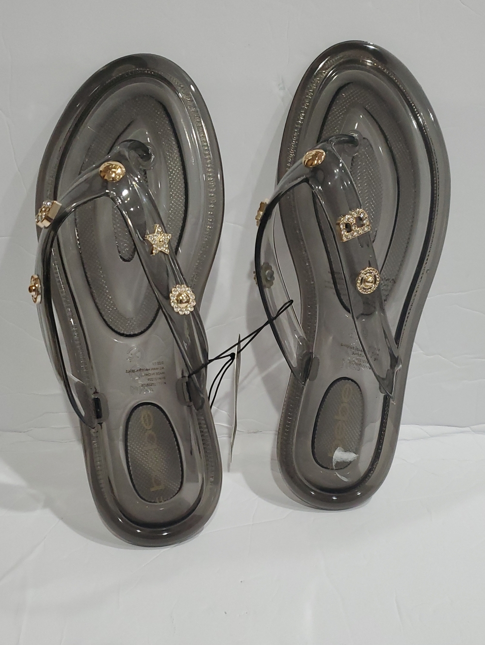 Bebe clear smoke cz studded B initial & gold charms jelly thong flats size 11